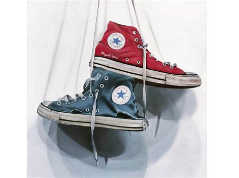 converse hanging from laces.